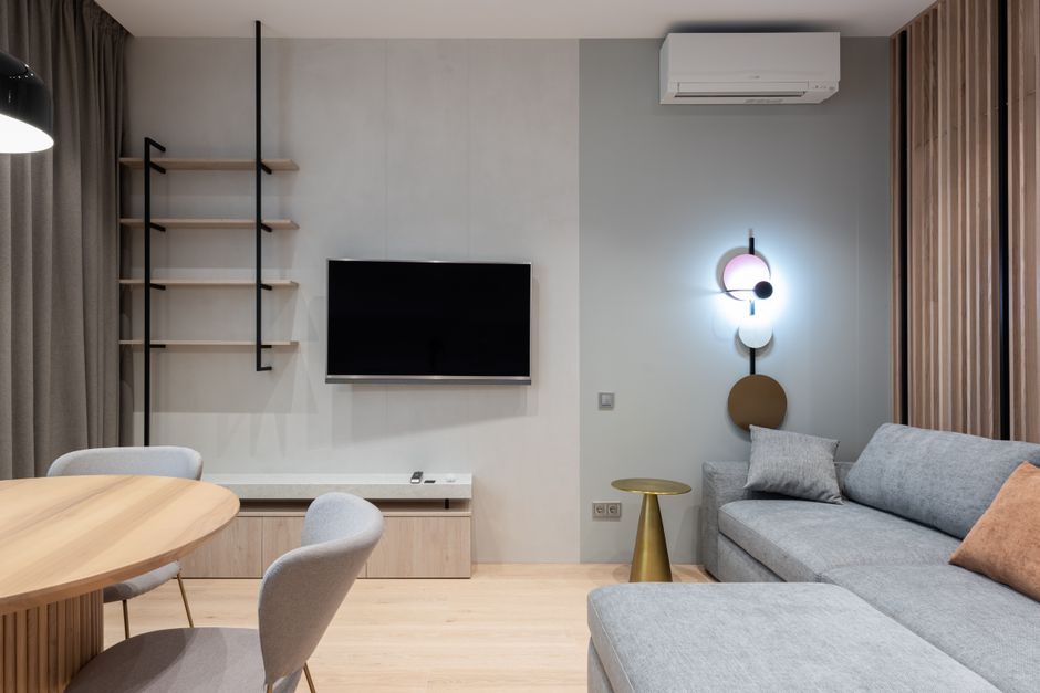 AC Not Cooling: 10 Common Causes and How to Fix Them | FAST HVAC Homeowner checking a thermostat because the air conditioner is not cooling the house